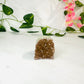 mini amethyst sugar druzy on a white counter top with leaves and flowers