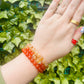 gemstone bracelet on womans writst. carnelian and citrine