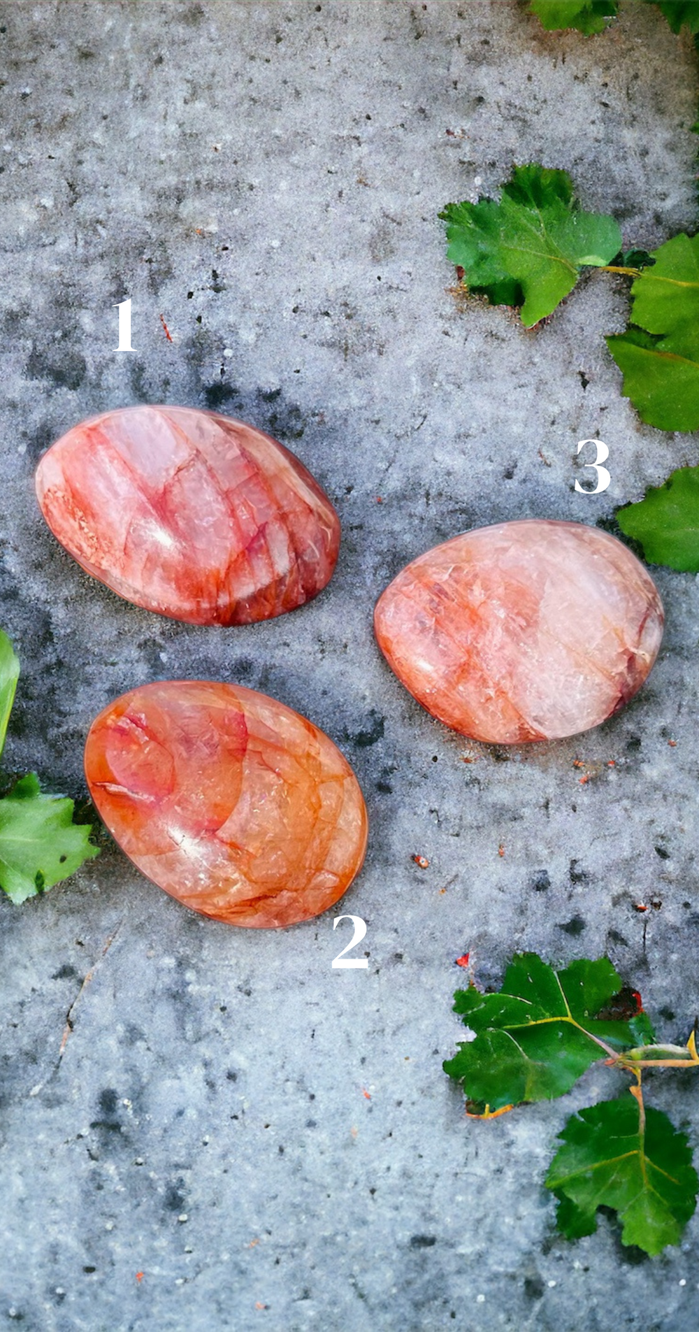 fire quartz palm stones laying on concrete outside