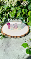 Fluorite Mushrooms crystals on wooden stump outside