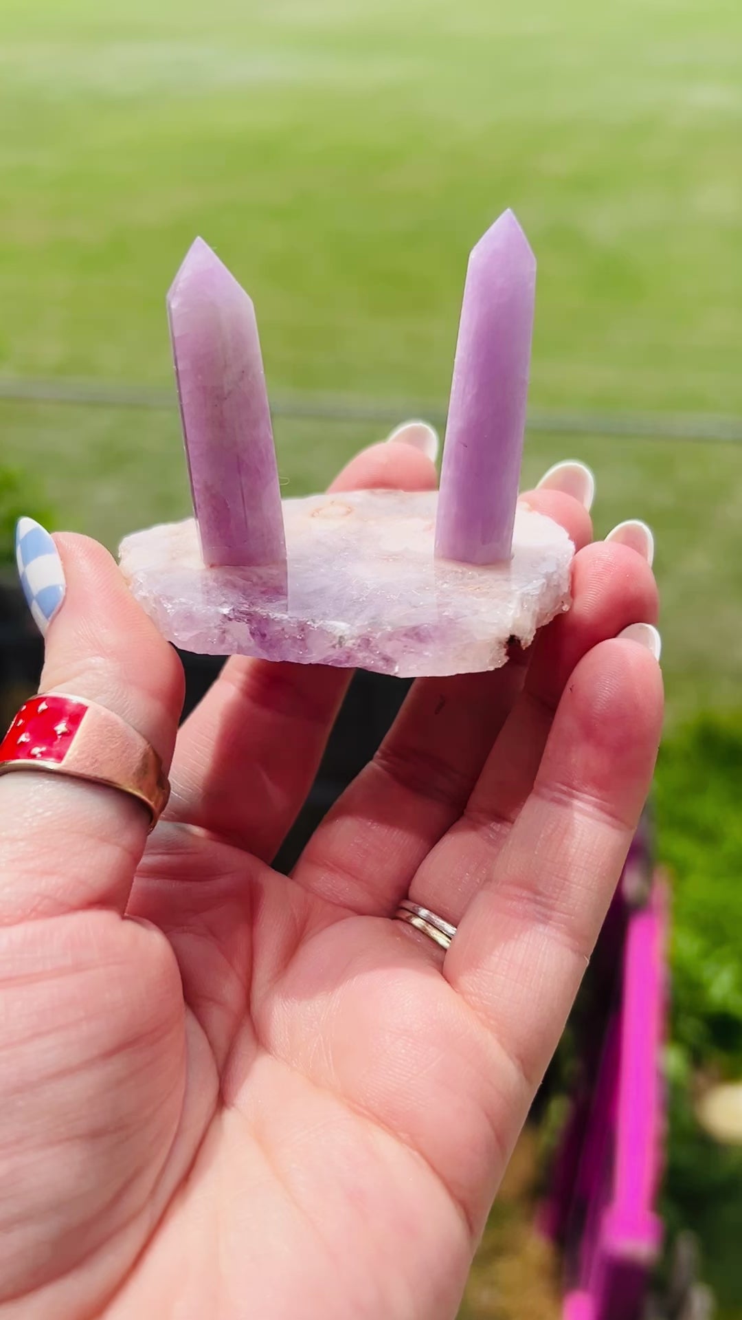 two kunzite towers sit on a pink amethyst base. handcrafted crystal ring holder fits ring sizes 2.5 and bigger. 