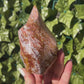 Ocean Jasper Spiral Tower in woman's hand outside